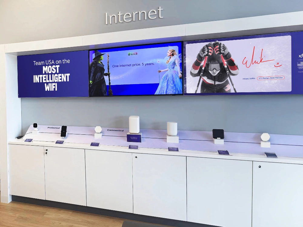 Large-format SEG lightboxes displaying real estate imagery in the underground pedestrian corridor at 1000 De La Gauchetière in Montreal.